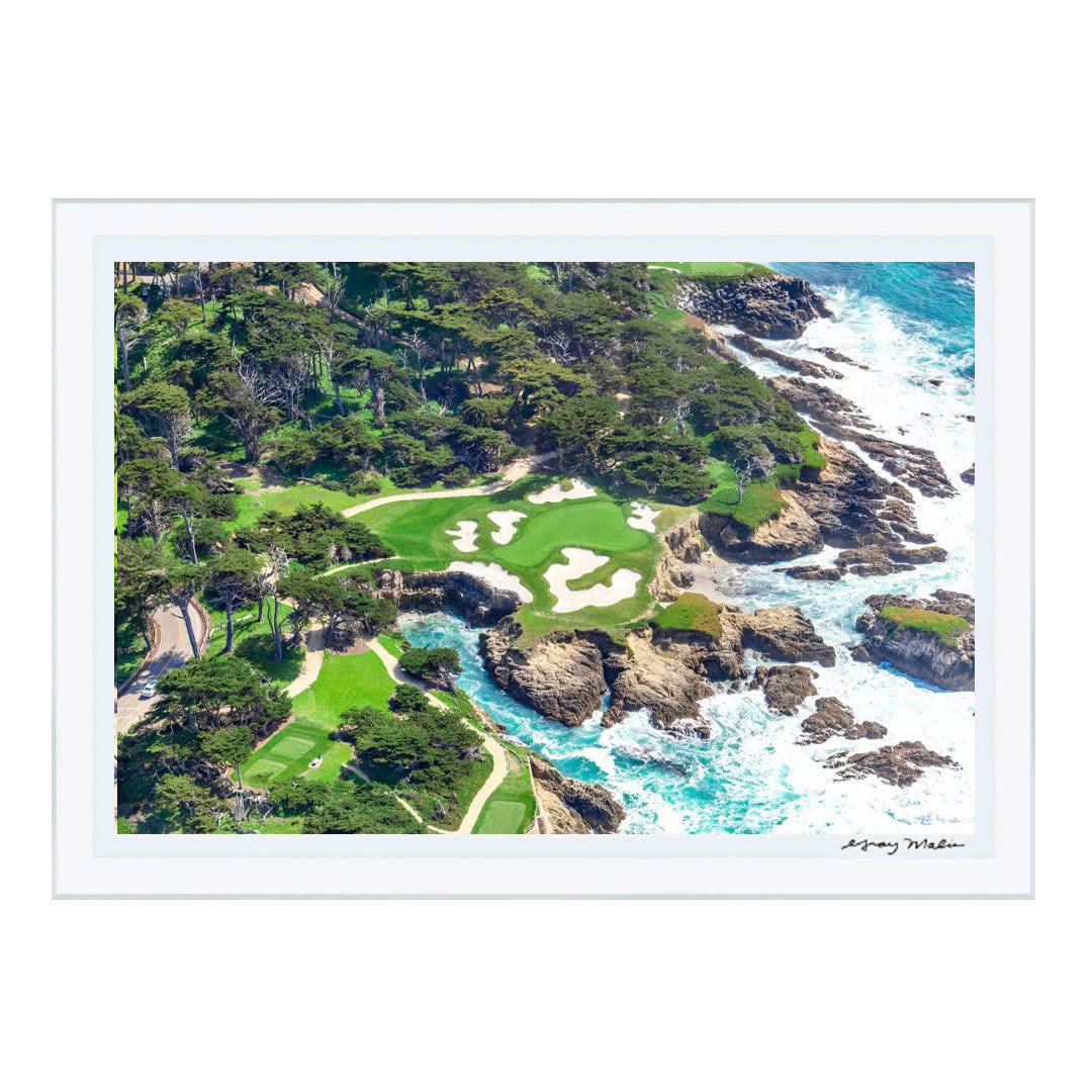Aerial view of coastal golf course with rocky shores