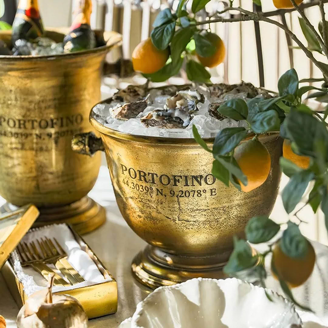 Oysters on ice in ornate Portofino bowls with lemons