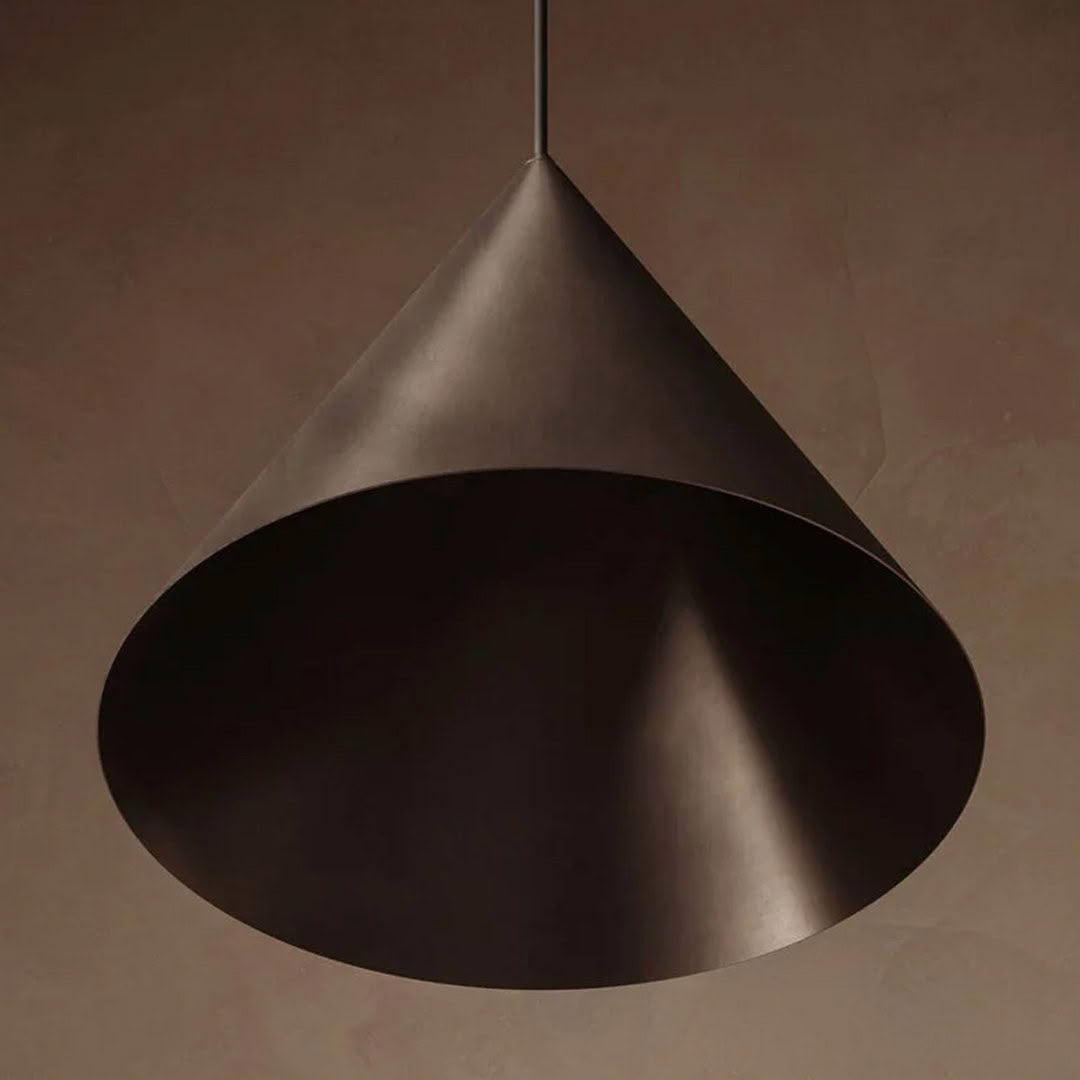 Modern cone-shaped pendant lamp in dark setting