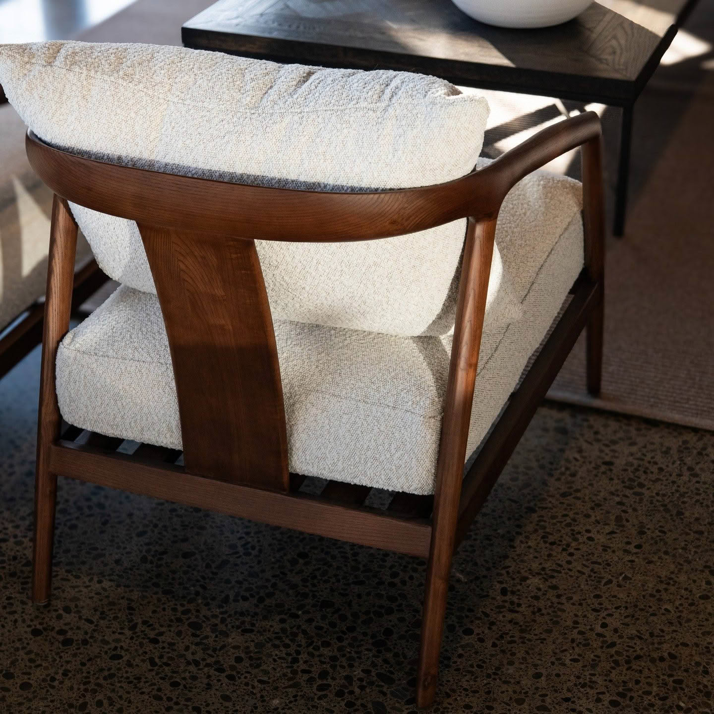 523108663_18350334391088561_3204178208613910467_n Modern walnut armchair with textured cream cushions