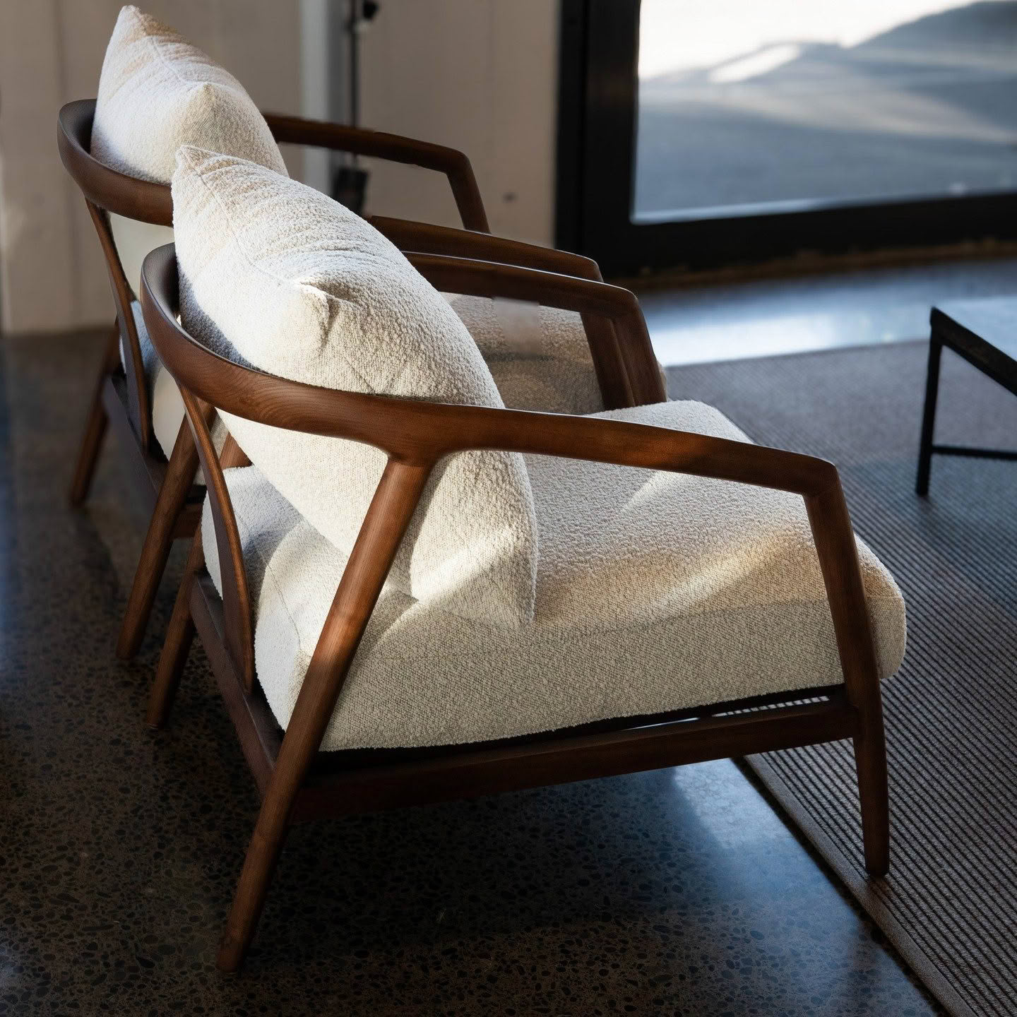 Modern wooden chair with white cushions indoor