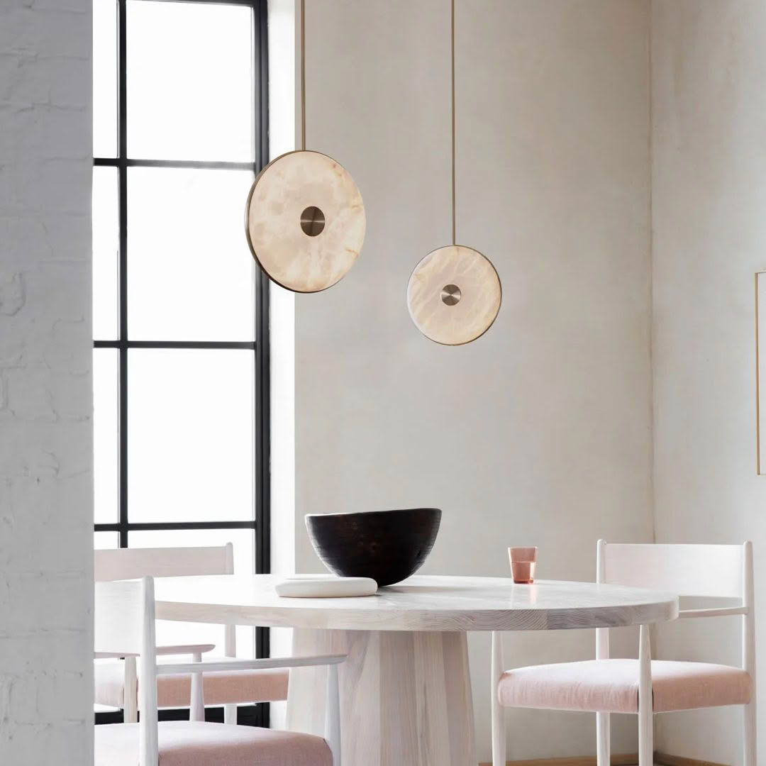 Minimalist dining room with stylish pendant lights