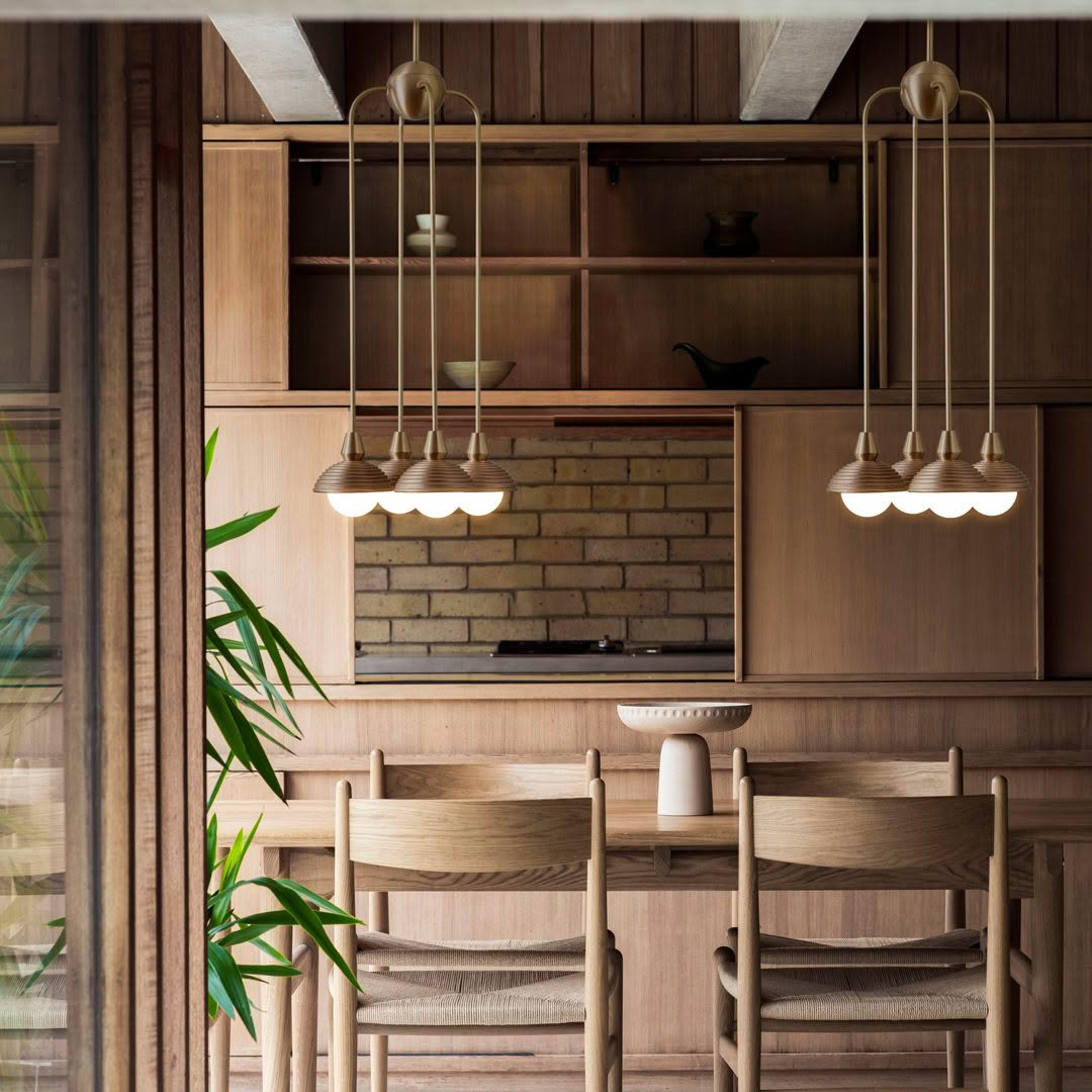 Stylish wooden kitchen interior with pendant lights