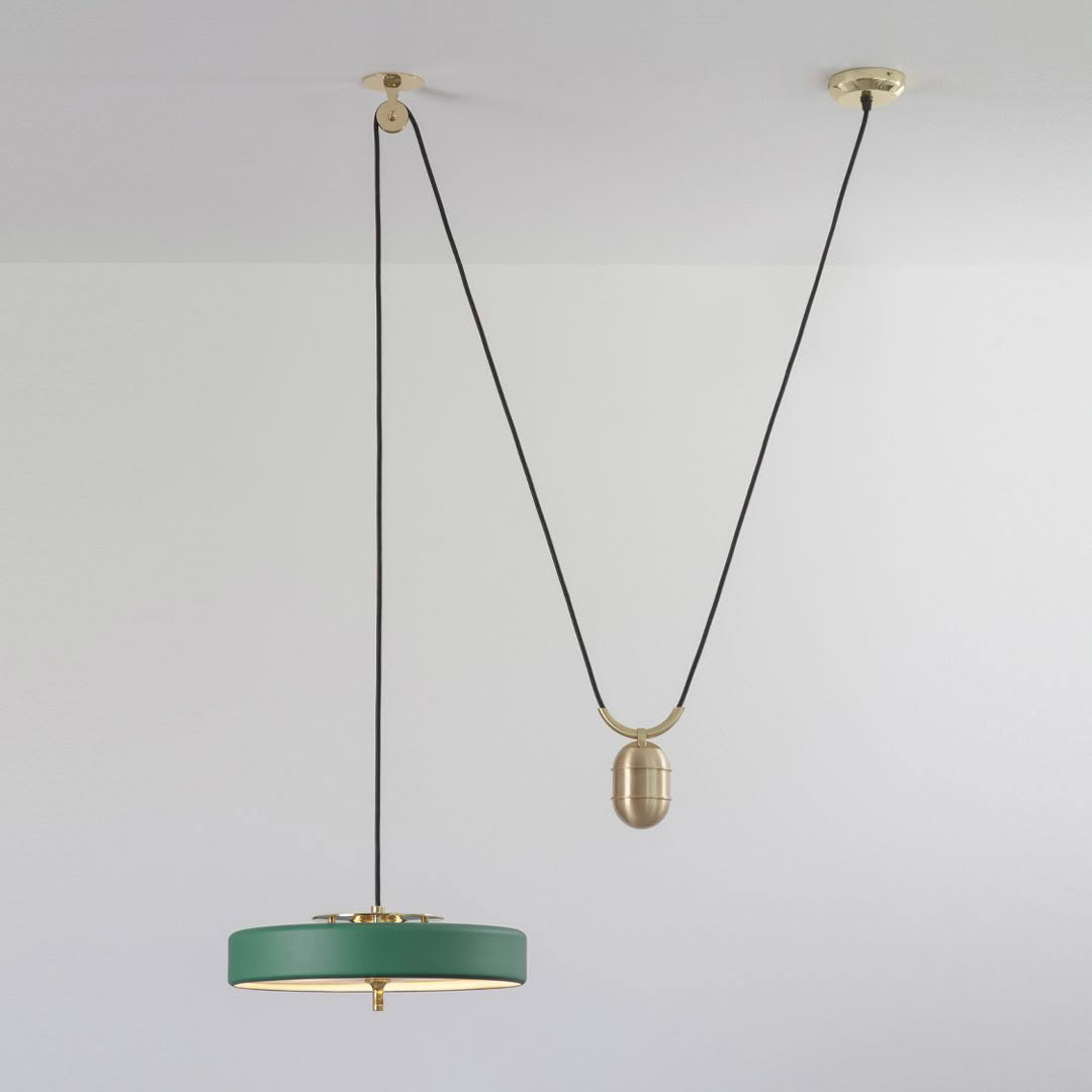 Modern green pendant light with dual brass mounts