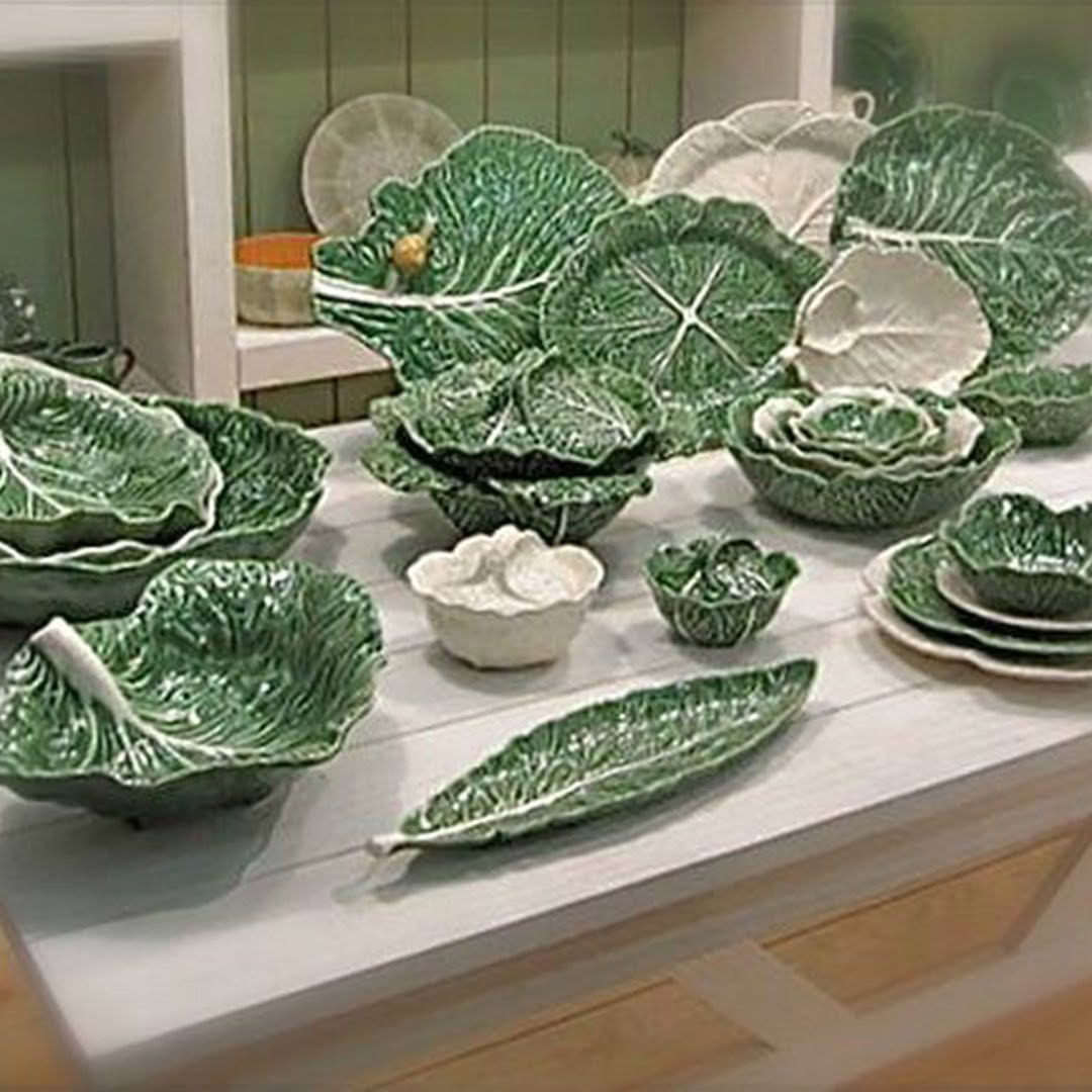 Collection of green leaf-shaped ceramic dishes on table