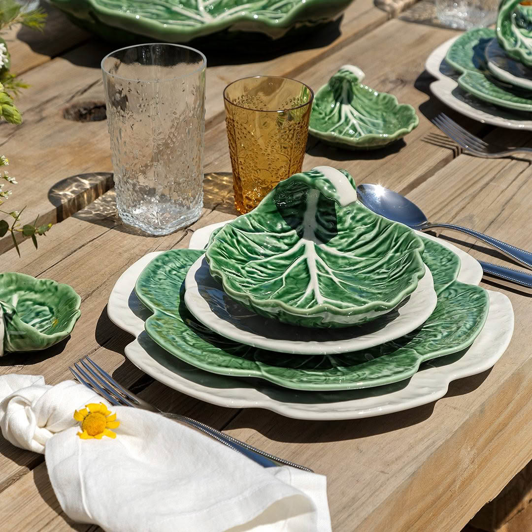 Cabbage-shaped plates on wooden outdoor dining table