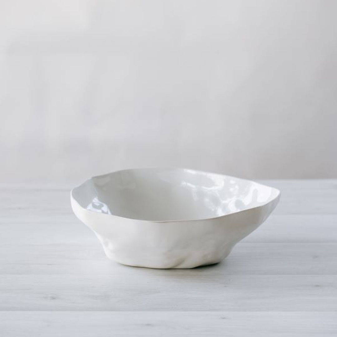 White ceramic bowl on wooden surface