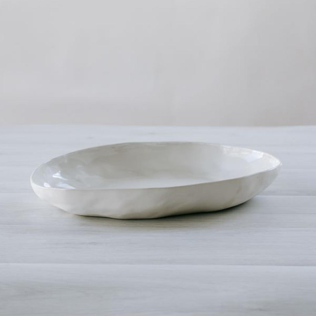 White ceramic plate on wooden table