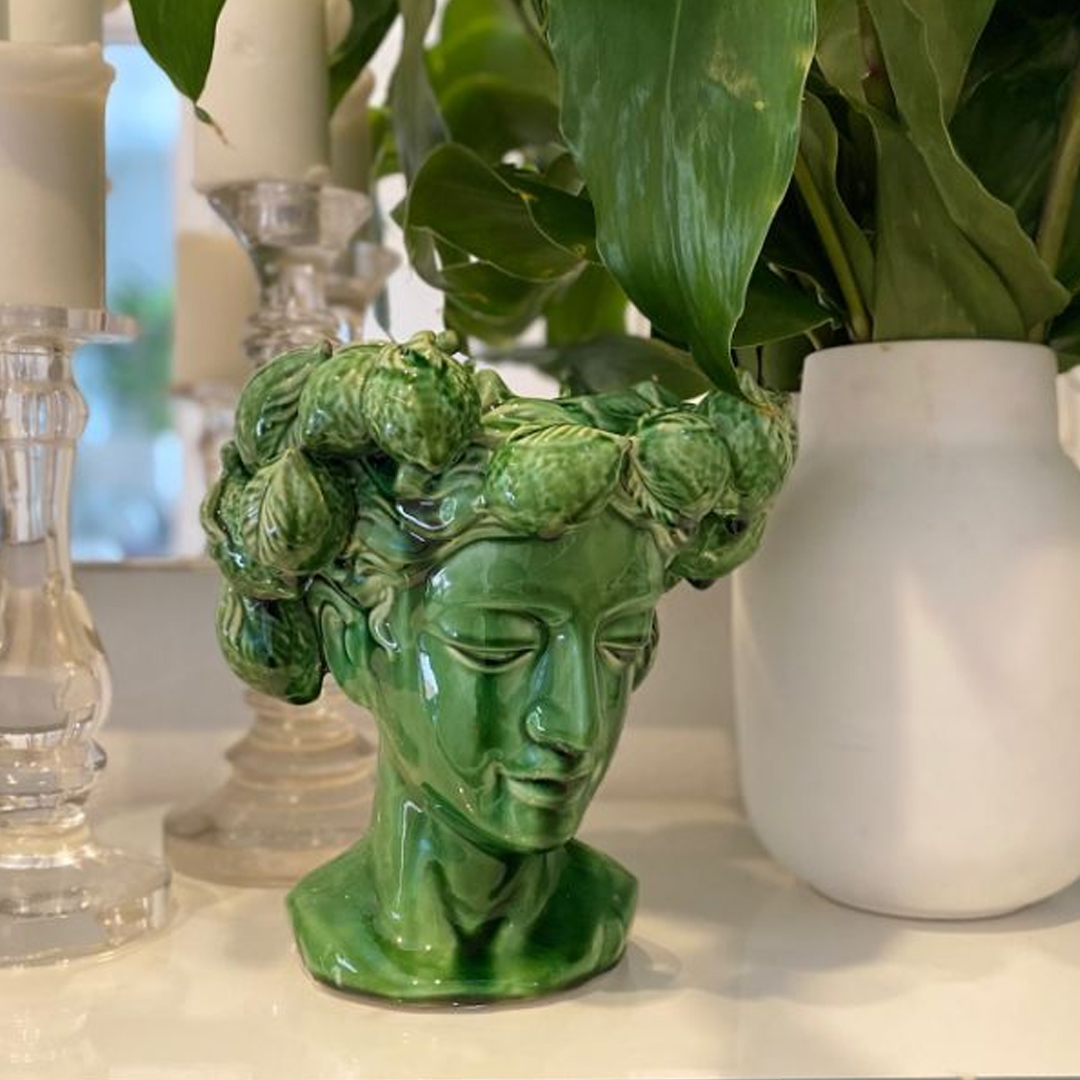 Green ceramic head planter with artichoke crown