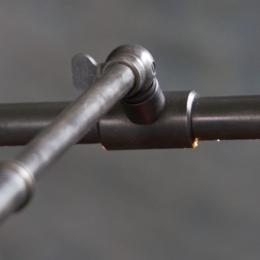 Close-up of welding torch joining metal pipes