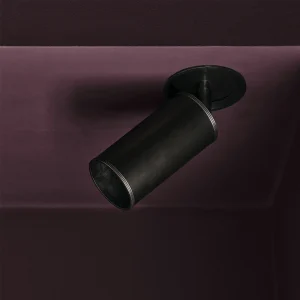 Black ceiling light fixture on maroon background