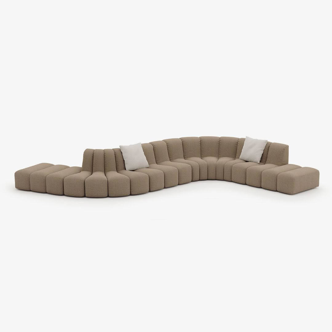 Modular beige sectional sofa with white cushions