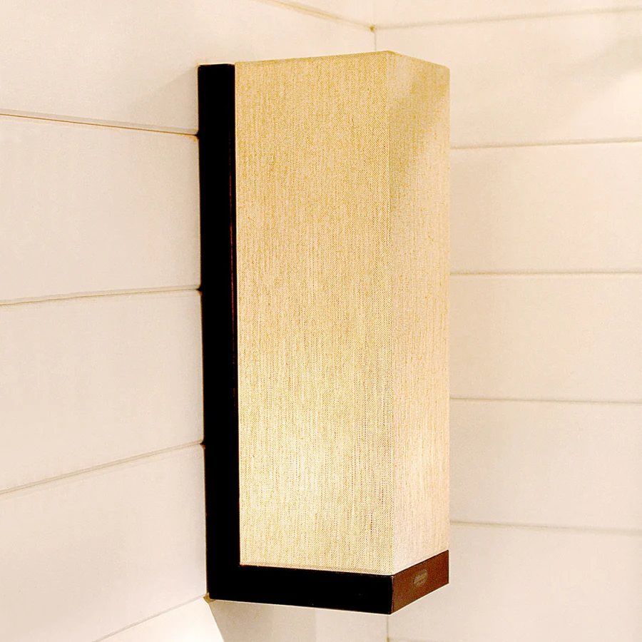 Modern beige wall-mounted light fixture in interior