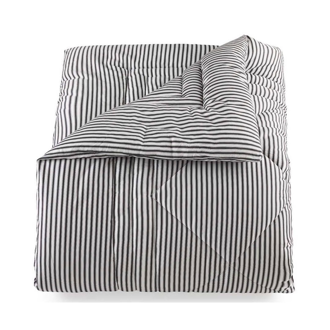 Black and white striped bedding set folded neatly