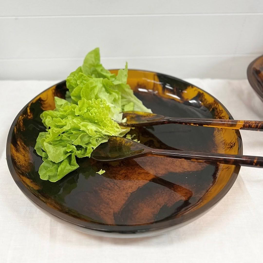 Green lettuce on brown dish with chopsticks