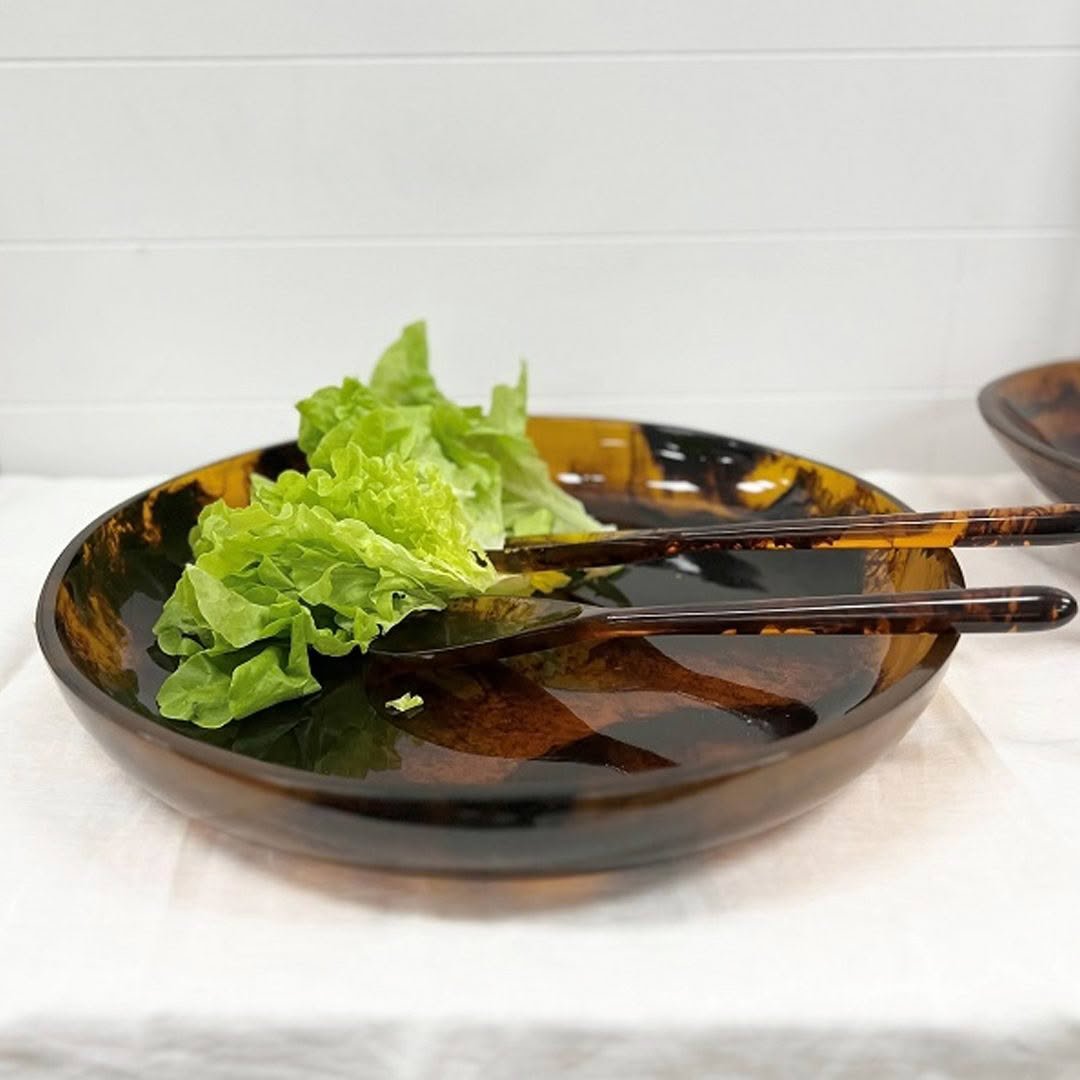 Fresh green lettuce in a dark brown serving bowl