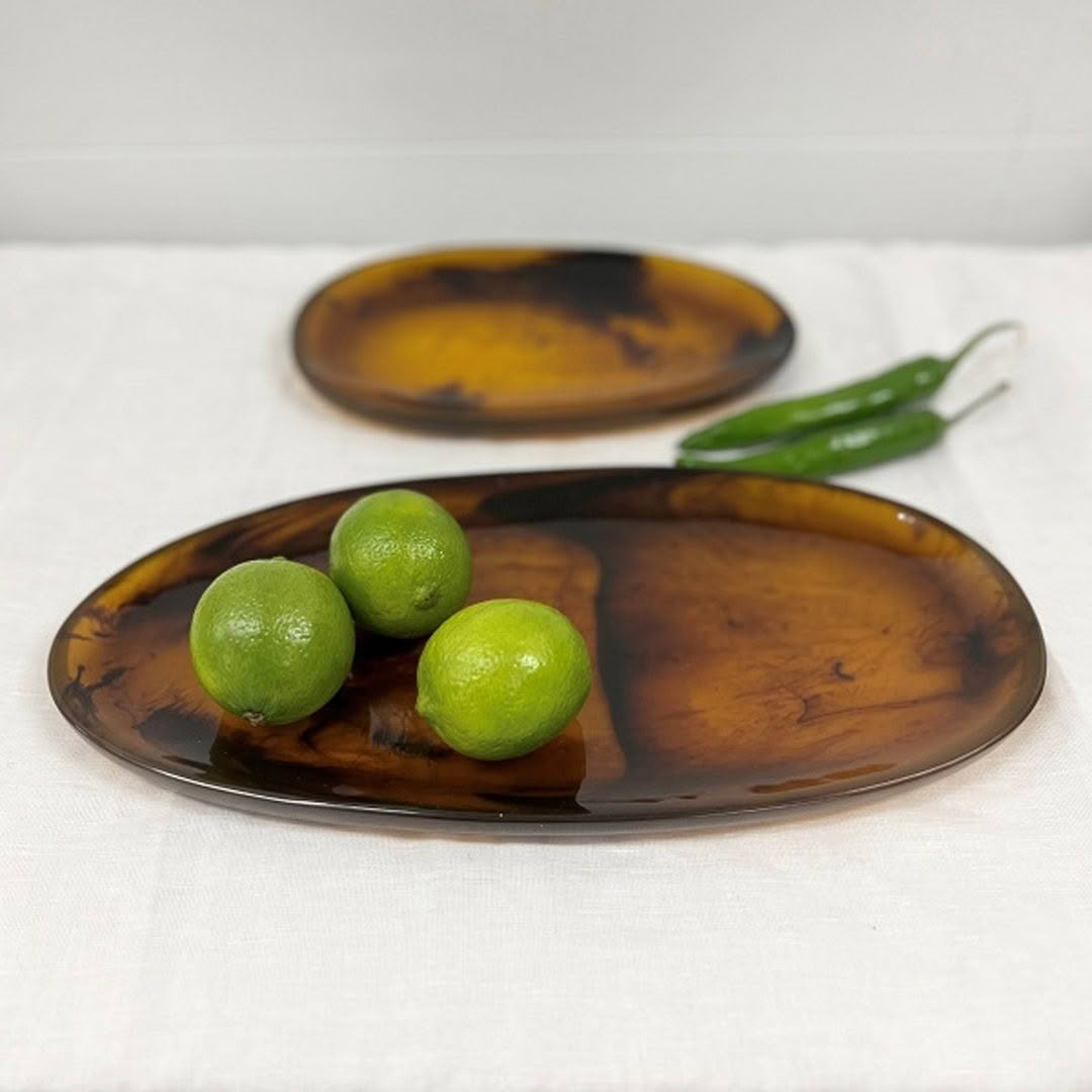 Limes and green chili on wooden plates