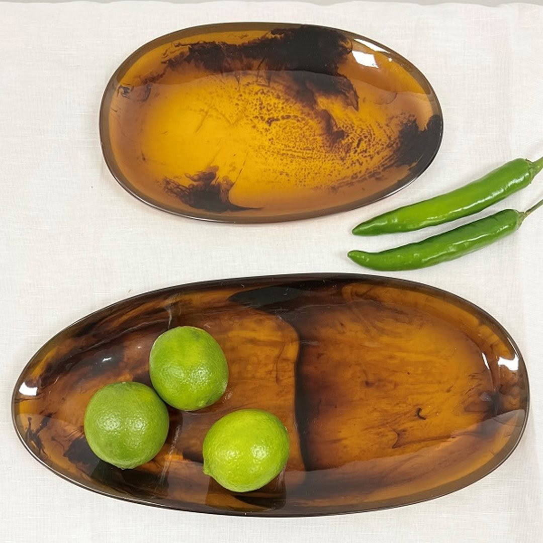 Two amber plates with limes and green chili peppers