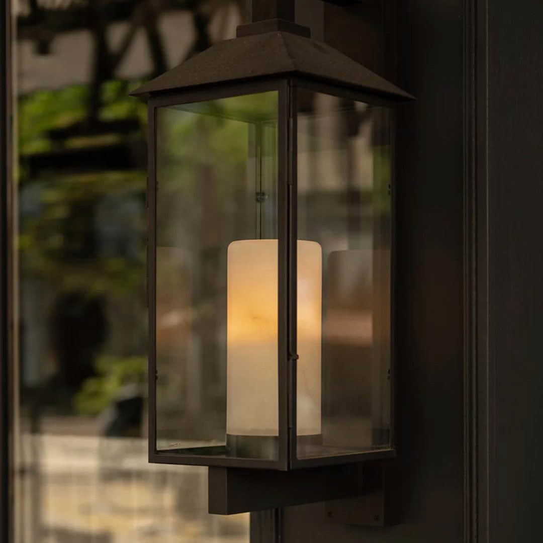 Outdoor lantern with glowing candle inside