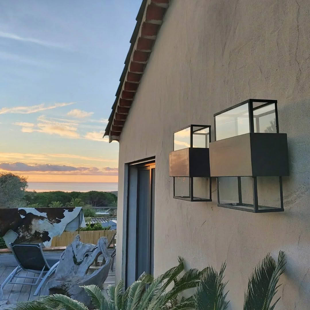 Sunset view from house with modern outdoor lamps